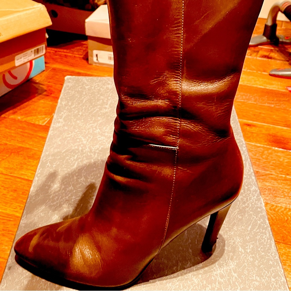 Brown knee boots with high heel.